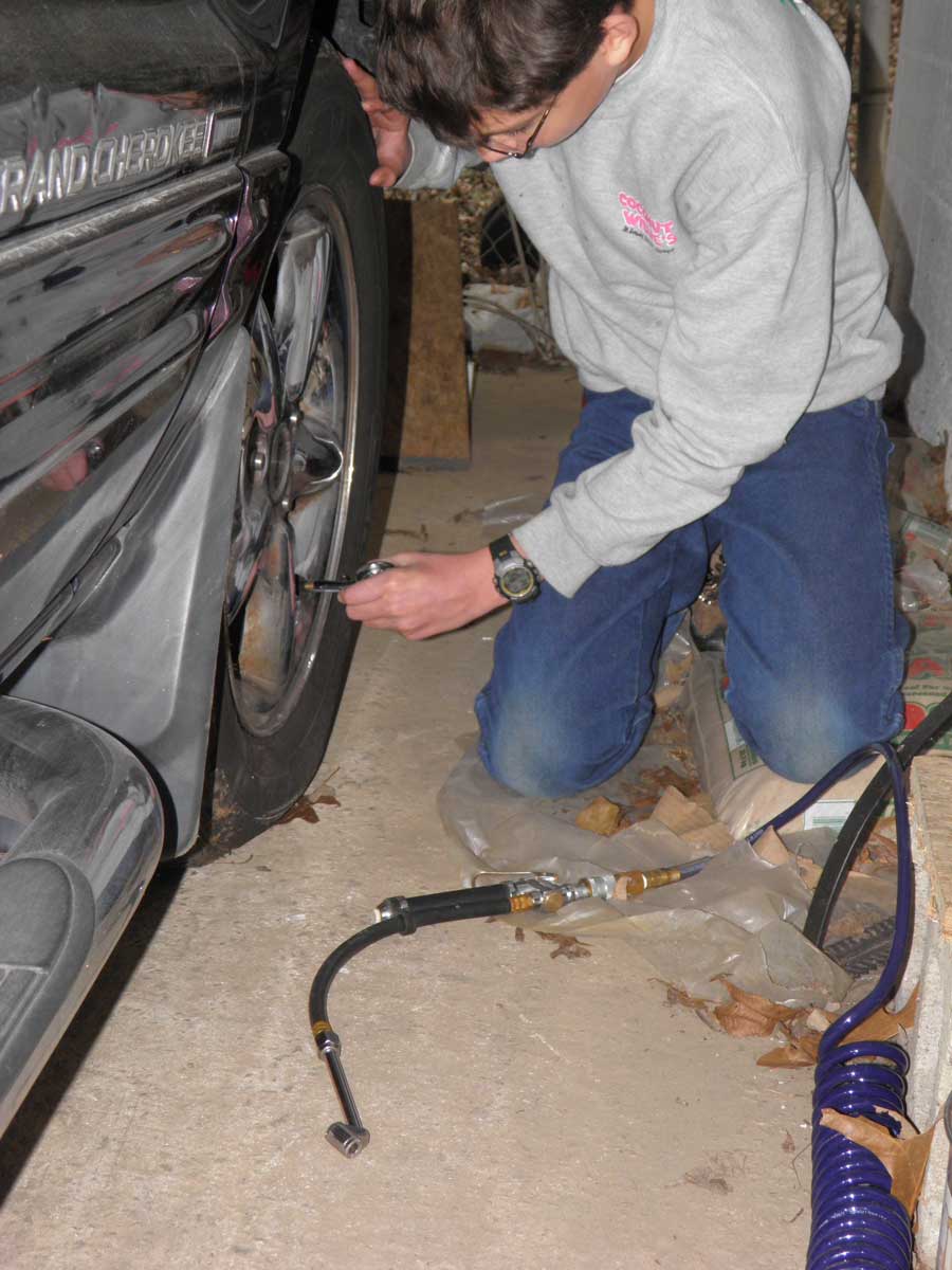 Putting Air in Auntie's tire